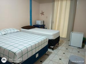Apartamentos no Farol Velho 객실 침대