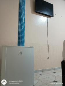 Apartamentos no Farol Velho TV 또는 엔터테인먼트 센터