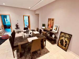 a dining room with a table and chairs at Villa Bahia Golf beach - Bouznika in Casablanca