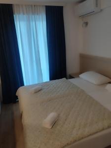 Postel nebo postele na pokoji v ubytování Motel Jadranka