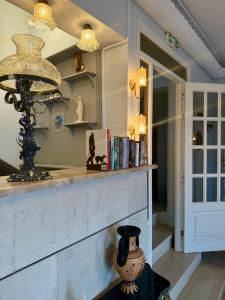 a room with a counter with a vase on a table at Hotel Derveni Georgiadis in Stómion