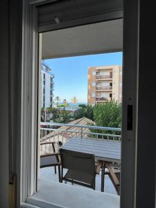 a view from a window of a table and a balcony at Bacarola in Los Mártires