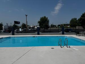 a blue swimming pool with a pair of tongs in it at Quality Inn & Suites in Cincinnati
