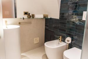 Koupelna v ubytování Madia's House by MONHOLIDAY