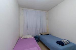 Ένα ή περισσότερα κρεβάτια σε δωμάτιο στο Apartamento girassois com ar condicionado