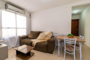 Χώρος καθιστικού στο Apartamento girassois com ar condicionado