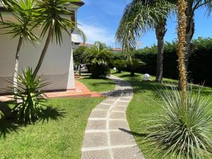 Κήπος έξω από το Hotel Toscano