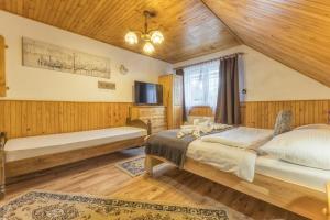 Posteľ alebo postele v izbe v ubytovaní Penzion Šilon