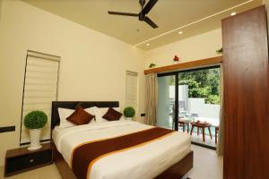 Postel nebo postele na pokoji v ubytování LA VILLA Resort + 6 fotografií