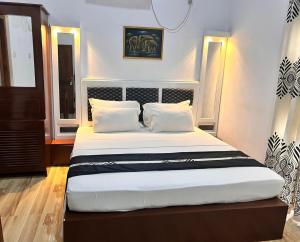 Postel nebo postele na pokoji v ubytování Grand Residence