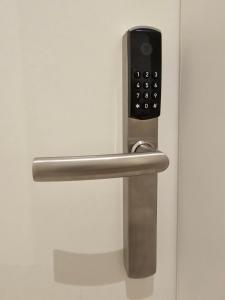 a door handle with a remote control on it at ApartHotel Rahl in Hamburg
