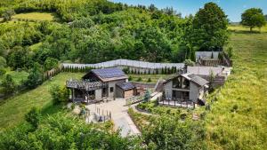 an aerial view of a house in a field at Amonte Mountain Resort in Muntele Rece