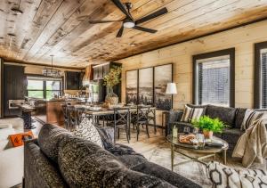 a living room with a couch and a table at The Wolf's Lantern Highway in Pigeon Forge
