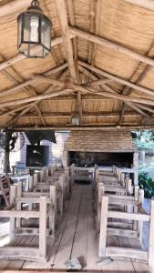 a row of tables and chairs in a building at las palmeras departamento planta alta Catamarca in San Isidro +18 photos