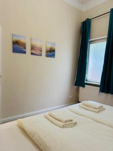 Ένα ή περισσότερα κρεβάτια σε δωμάτιο στο Am Geeste Apartment Ihr gemütliches Zuhause auf Zeit in Bremerhaven