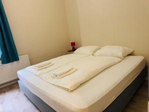 Ένα ή περισσότερα κρεβάτια σε δωμάτιο στο Am Geeste Apartment Ihr gemütliches Zuhause auf Zeit in Bremerhaven