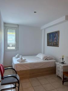 Ένα ή περισσότερα κρεβάτια σε δωμάτιο στο Apartamento Oliva Vora II +19 φωτογραφίες