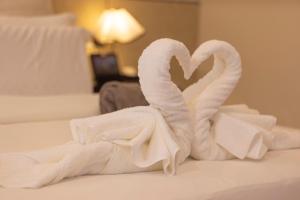 Voodi või voodid majutusasutuse YUSU Hotel 羽宿酒店 toas