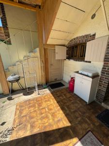 an empty kitchen with a stove and a counter at Studio St Florentin 2 in Saint-Florentin
