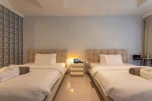 Voodi või voodid majutusasutuse YUSU Hotel 羽宿酒店 toas