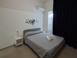 Postel nebo postele na pokoji v ubytování KiMia Home, Centro