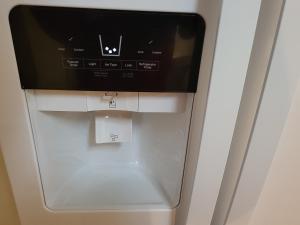 a coffee machine with a monitor on top of it at Cara Drive Room in Springdale +7 photos