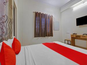 Ліжко або ліжка в номері Hotel O SVR Silver Key