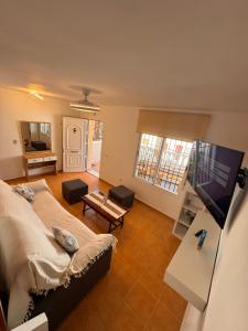 Et tv og/eller underholdning på Casa de playa mediterránea, a metros de la playa