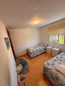 En eller flere senge i et værelse på Casa de playa mediterránea, a metros de la playa