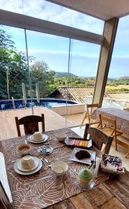 Un balcon sau o terasă la Altos da Brava Búzios Guest House +65 fotografii
