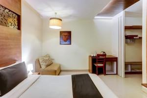 Postel nebo postele na pokoji v ubytování Hotel O GN International