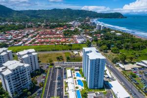 an aerial view of a city and the beach at Viva Jaco Unit 0605 in Jacó