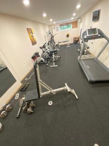 a gym with treadmills and elliptical machines at Sea View Panoramic Apartments, Fort Noks Crown Club in Sveti Vlas