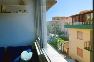 a window with a view of a city at GIANGY HOME in Casteldaccia