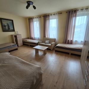 a living room with two beds and a couch at Central Apartment in Gera