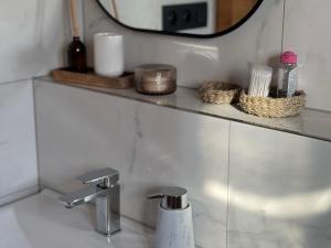 a bathroom with a sink and a mirror at Apartmán Hrabušice G3 - Slovenský Raj in Hrabušice +6 photos