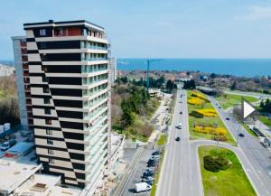 a tall building on the side of a road at Seaview Smart Home 2 in Varna City