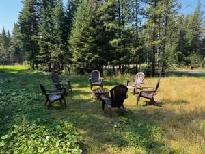 a group of chairs sitting in a field at Chalet Mirasol in Valcartier Station