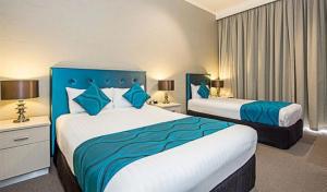 Pavilion Hotel Wagga Wagga客房内的一张或多张床位