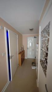 a room with a hallway with a door and a room with a hallway at The Bridge in Dartford +11 photos