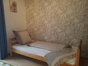 a bench in front of a wall with a wallpaper at Ferienwohnung Amöneburg In Amöneburg in Amöneburg +23 photos