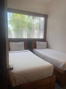 Voodi või voodid majutusasutuse Palm View Villa toas