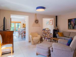 a living room with a couch and a tv at Holiday home in Tinjan - Istrien 52053 in Tinjan