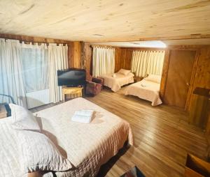 Postelja oz. postelje v sobi nastanitve Hostal Chumay