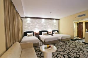 Krevet ili kreveti u jedinici u okviru objekta Hotel New Saphir Yogyakarta
