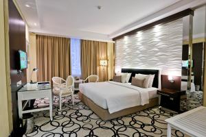 Krevet ili kreveti u jedinici u okviru objekta Hotel New Saphir Yogyakarta