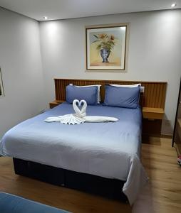 Ένα ή περισσότερα κρεβάτια σε δωμάτιο στο Incrível flat Cavalinho Branco em Aguas de Lindoia