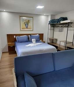 Ένα ή περισσότερα κρεβάτια σε δωμάτιο στο Incrível flat Cavalinho Branco em Aguas de Lindoia