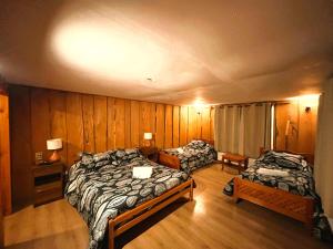 Postelja oz. postelje v sobi nastanitve Hostal Chumay