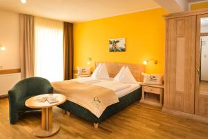 Postel nebo postele na pokoji v ubytování Der Thaller - Wirtshaus - Restaurant - Hotel
